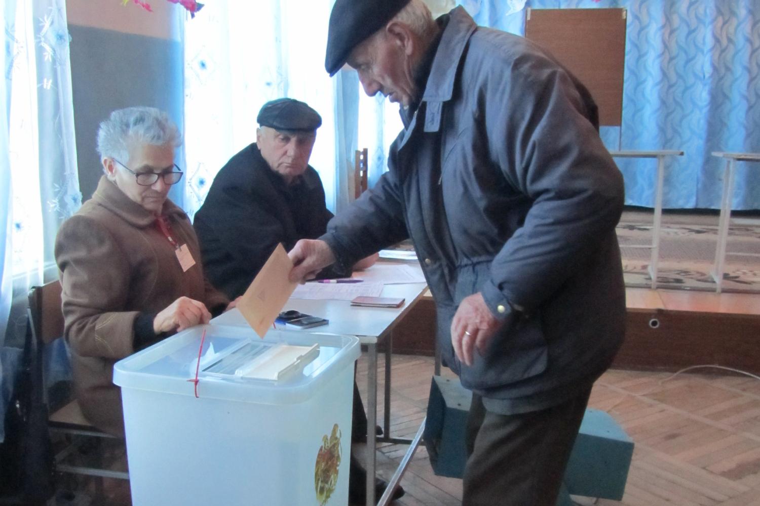 Man casting ballot in Armenia