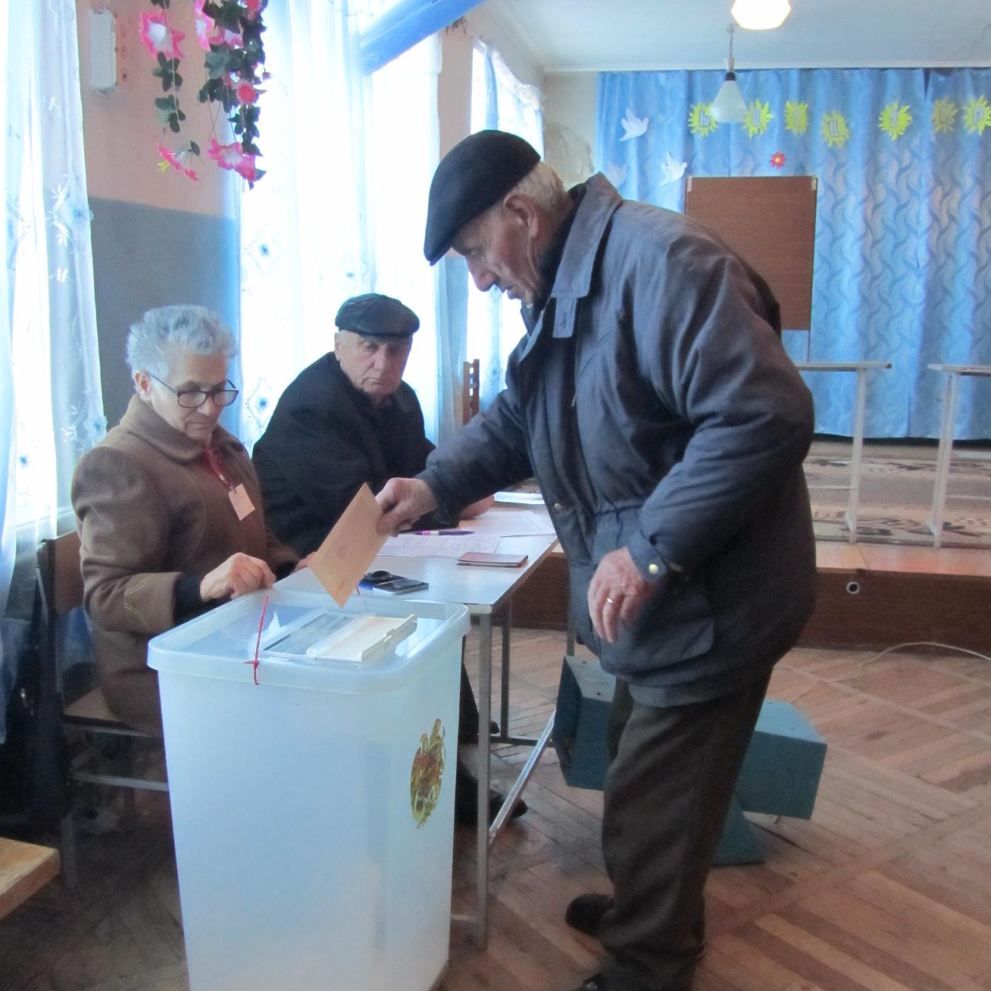 Man casting ballot in Armenia