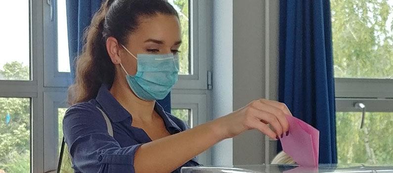 A Serbian voter casts her ballot on Election Day.