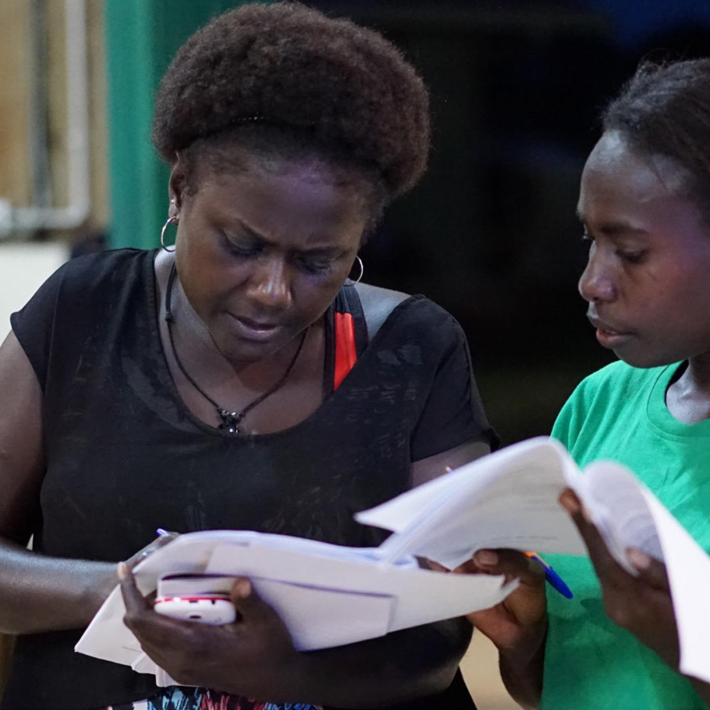 Two women take part in a mock polling observer training in the Autonomous Region of Bougainville