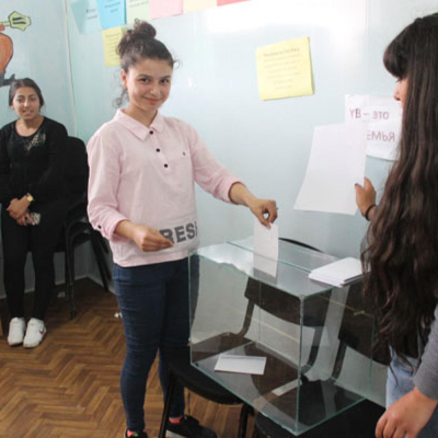IFES Democracy and Citizenship course alumni implement peer-to-peer voter education project by simulating polling station operations.