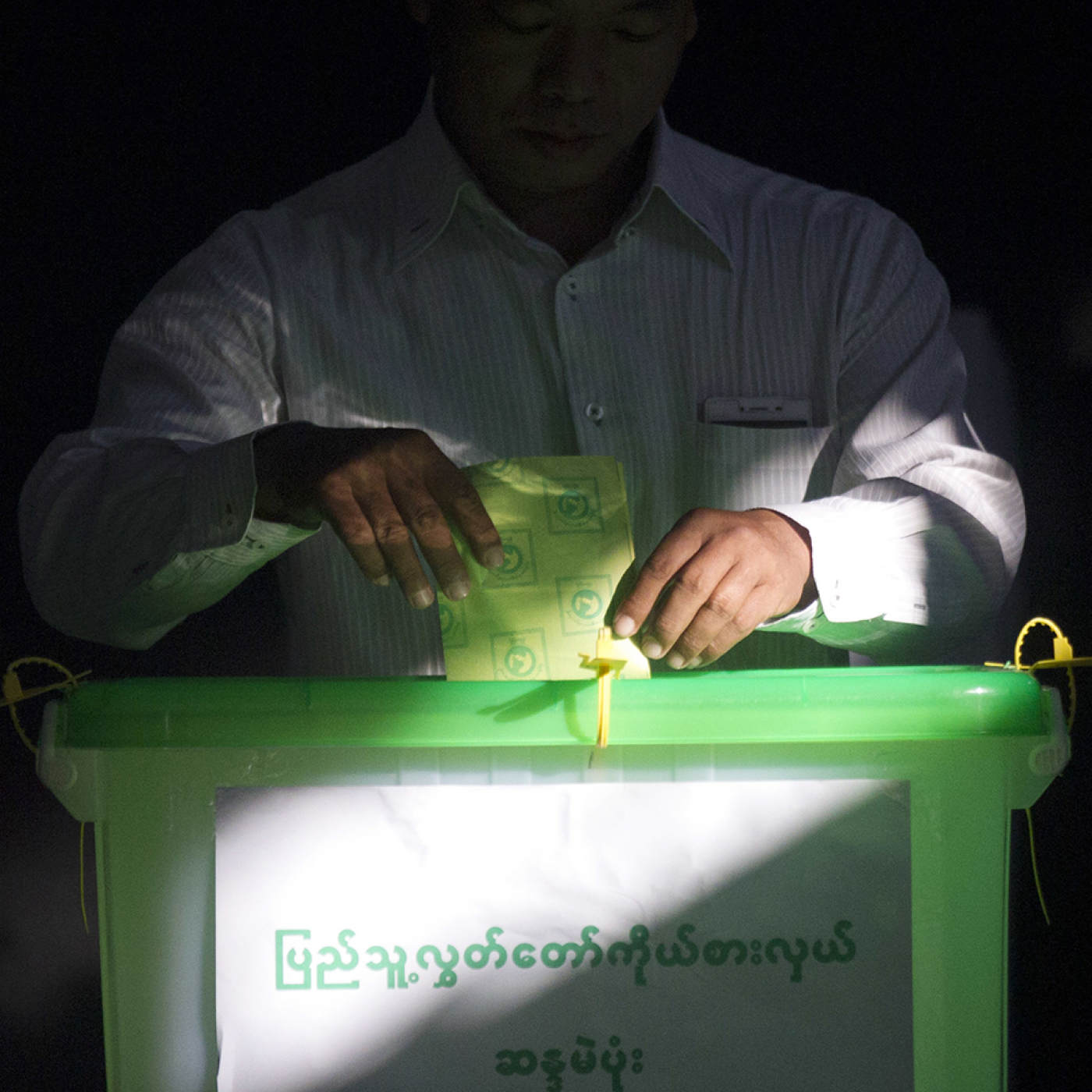 A voter casts his ballot at a polling station in Yangon, Myanmar, during the 2018 by-elections.