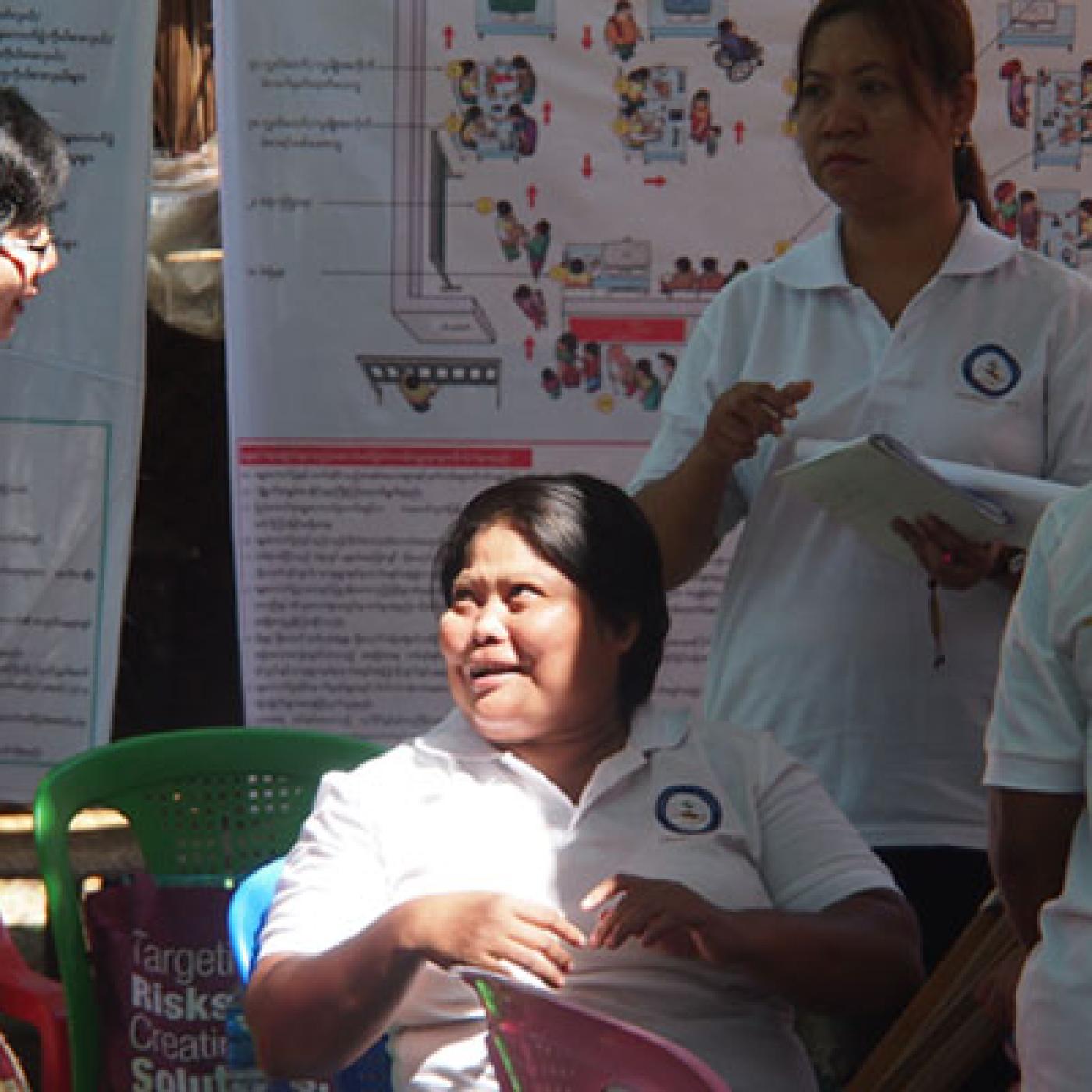Khin San Wai (center) talking to Yaung Chi Thit Director, Khin Hla (left) at one of the She Leads voter education events in Okkan township